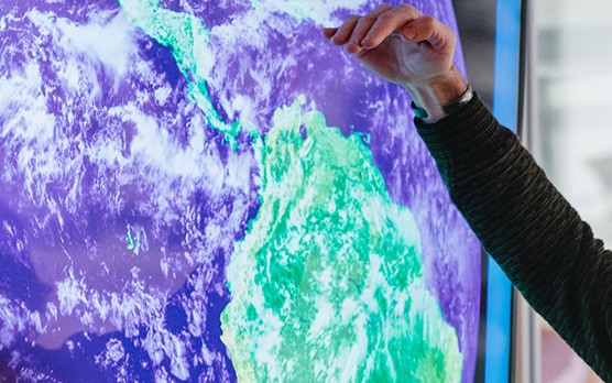hand pointing to screen
